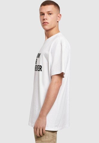 T-Shirt 'Now Or Never' Merchcode en blanc