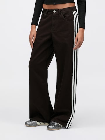 ruda ADIDAS ORIGINALS Plačios klešnės Džinsai 'FIREBIRD': priekis