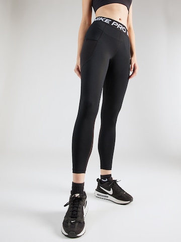 NIKE Skinny Workout Pants in Black: front