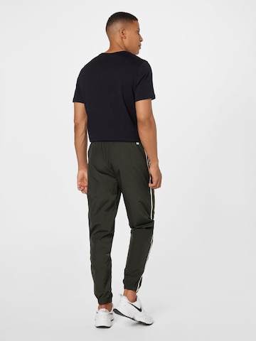 Nike Sportswear Конический (Tapered) Штаны в Зеленый
