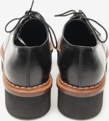 Tod's Flats & Loafers in 36 in Black