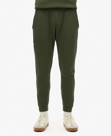 Superdry Tapered Pants in Green: front