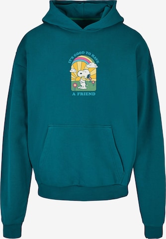 Merchcode Sweatshirt ' Peanuts - It's good to have a friend ' in Blauw: voorkant