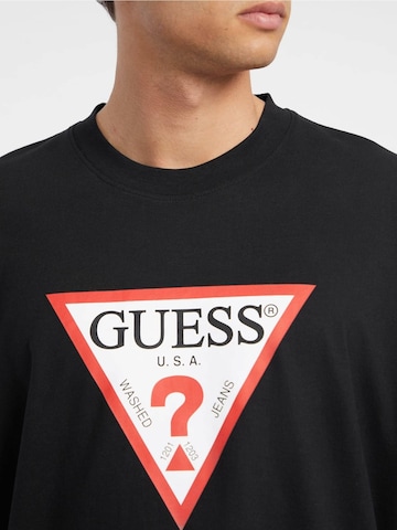 GUESS T-Shirt ' ICONIC' in Schwarz