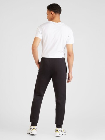 Champion Authentic Athletic Apparel Tapered Hose in Schwarz