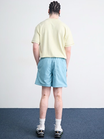 Nike SportswearLoosefit Hlače 'Club' - plava boja