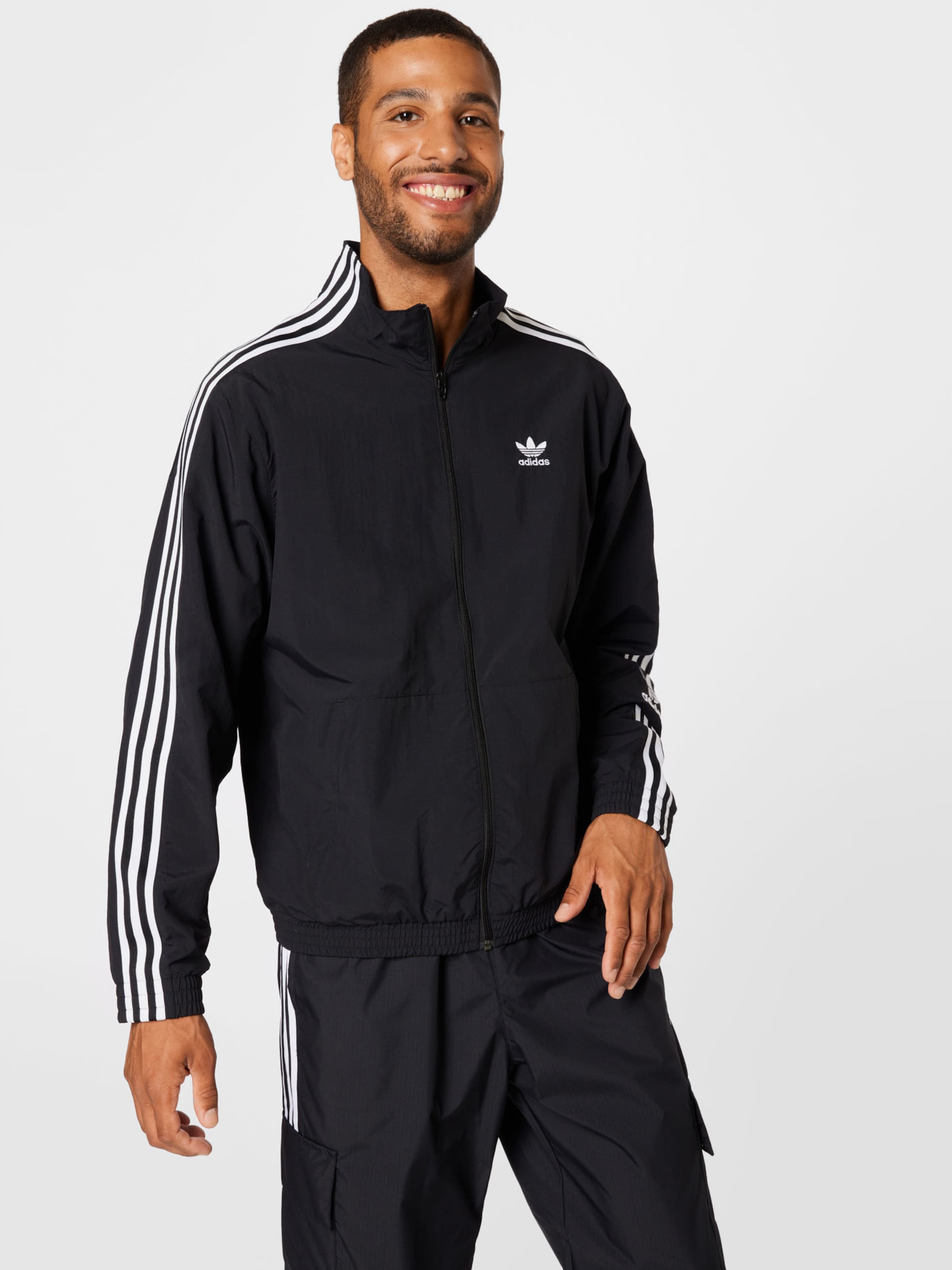 Adidas originals locked up logo track jacket in hotsell black