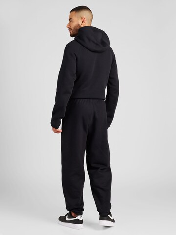 Nike Sportswear Tapered Sportbroek 'Swoosh' in Zwart