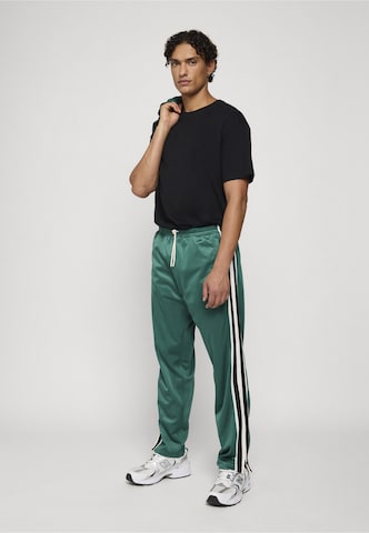 Regular Pantalon de sport Unfair Athletics en vert