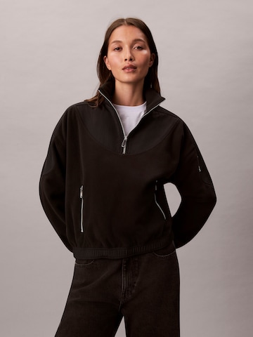Veste de survêtement Calvin Klein Jeans en noir : devant