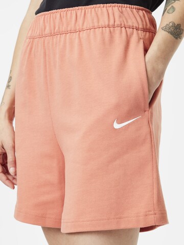 oranžs Nike Sportswear Vaļīgs piegriezums Bikses