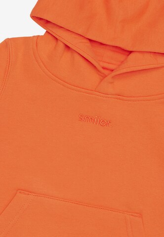 smiler. Sweatshirt in Orange