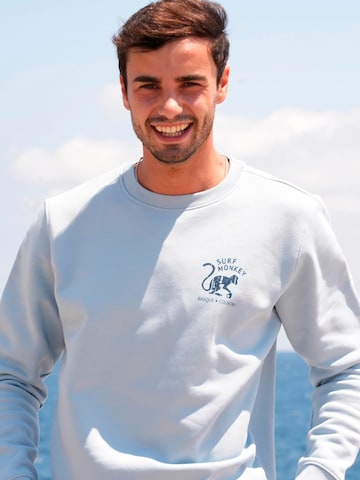 Surf Monkey - Sudadera 'Rette das Ozean' en azul