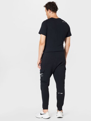 Effilé Pantalon cargo Nike Sportswear en noir