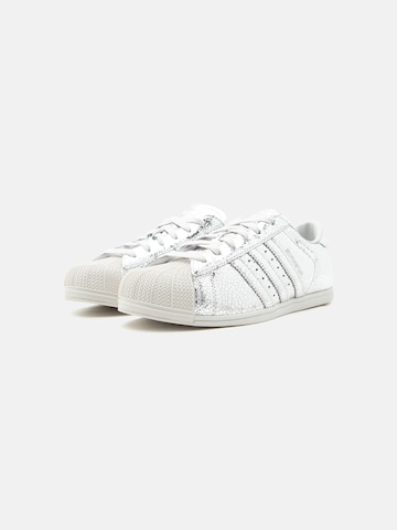 sidabrinė ADIDAS ORIGINALS Sportbačiai be auliuko 'SUPERSTAR'