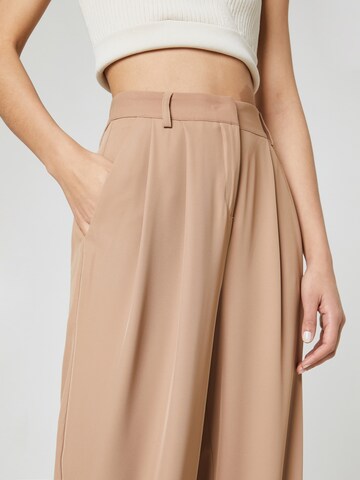 Guido Maria Kretschmer Women Loose fit Pleat-front trousers 'Mila' in Beige