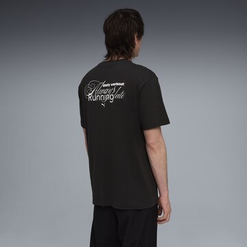 PUMA Shirt 'Slogan' in Zwart