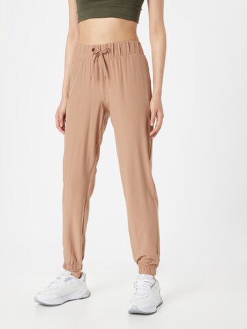 Athlecia Tapered Sports trousers 'Austberg' in Brown: front