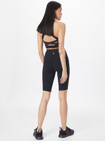 SKECHERS Skinny Sportbroek in Zwart