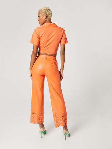 Katy Perry exclusive for ABOUT YOU Flared Hose 'Nala' in Orange