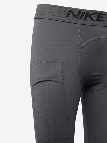Skinny Pantalon de sport NIKE en gris
