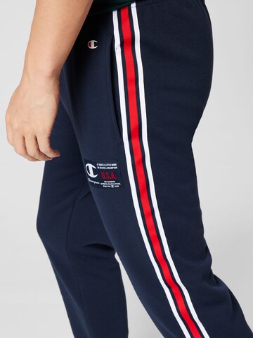 Champion Authentic Athletic Apparel Zwężany krój Spodnie w kolorze niebieski