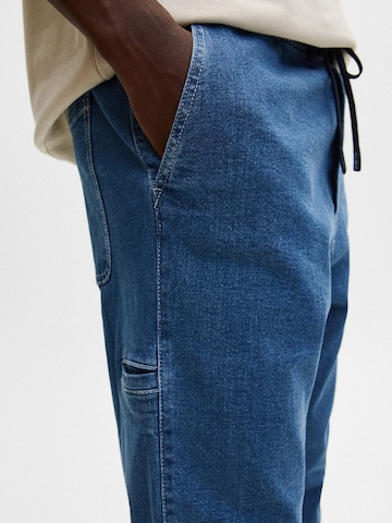 Pull&Bear Tapered Jeans i blå