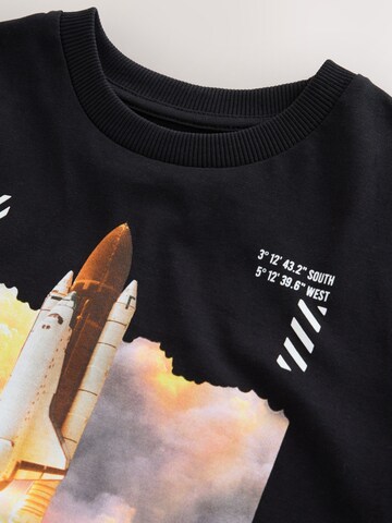 Next - Camiseta 'NASA' en negro