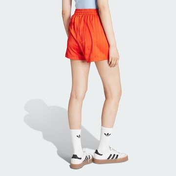 ADIDAS ORIGINALS Свободный крой Штаны в Оранжевый