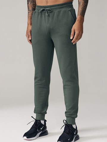 Next Tapered Workout Pants in Green: front