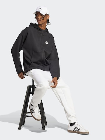 ADIDAS SPORTSWEAR Спортна жилетка с качулка 'FI' в черно: отпред