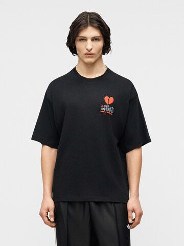 Tricou 'V-Day Heart Broken Cat' de la ADIDAS ORIGINALS pe negru