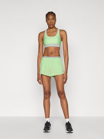 UNDER ARMOUR Бюстье Спортивный бюстгальтер в Зеленый