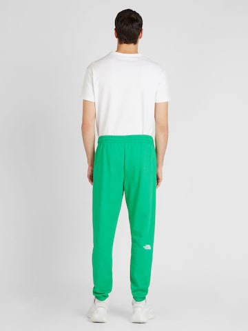 Tapered Pantaloni 'ESSENTIAL' di THE NORTH FACE in verde