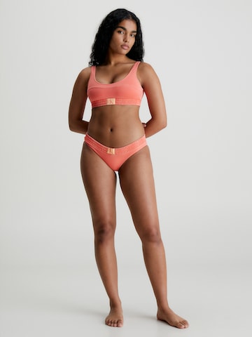 Calvin Klein Swimwear Dół bikini w kolorze pomarańczowy