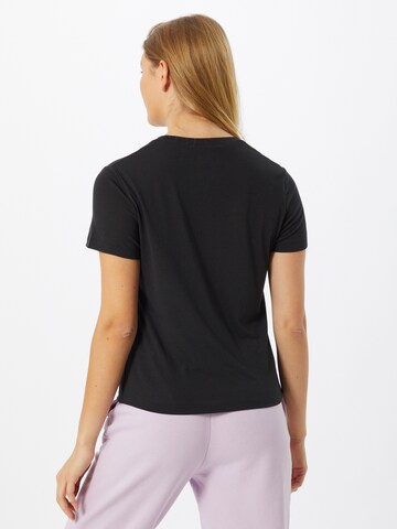 Reebok Skinny Toiminnallinen paita 'Modern Safari' värissä musta
