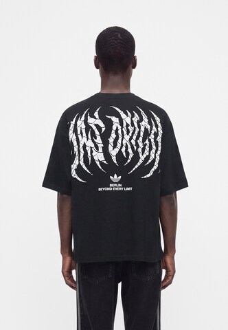 ADIDAS ORIGINALS Μπλουζάκι 'BERLIN' σε μαύρο: μπροστά