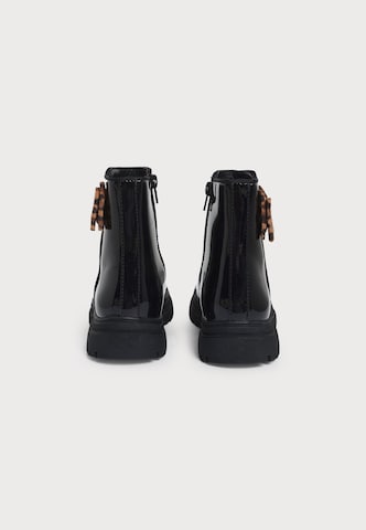 ABOUT YOU Boots 'Stina' in Black