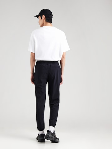 Tapered Pantaloni sportivi di SKECHERS in nero