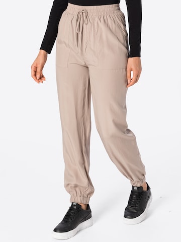 Loosefit Pantaloni de la Warehouse pe bej: față