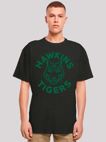 F4NT4STIC Shirt 'Stranger Things Hawkins Tigers Netflix TV Series' in Zwart: voorkant