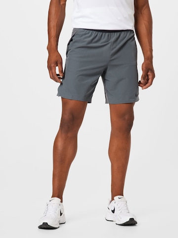 NIKE Regular Sports trousers in Grey: front