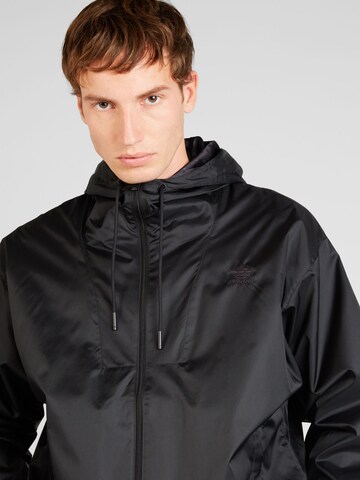 ADIDAS ORIGINALS - Chaqueta de entretiempo en negro