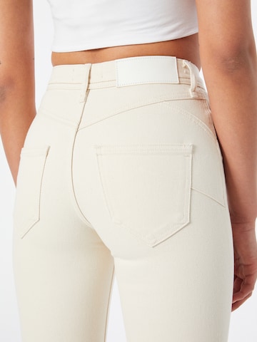 Flared Jeans di River Island in beige