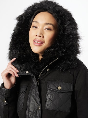 melns River Island Ziemas parka