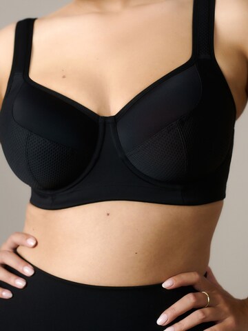 Invisible Soutien-gorge de sport Next en noir