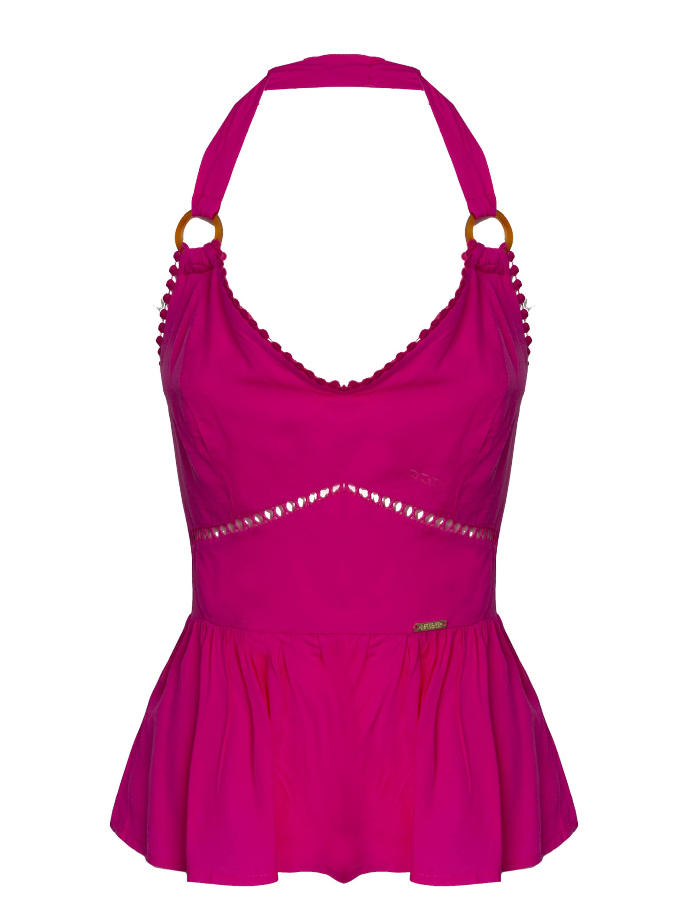 rozā Influencer Topiņš: no priekšpuses