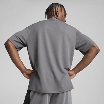 PUMA Performance shirt 'Posterize' in Grey