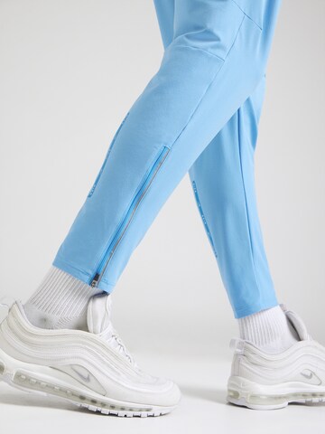 Effilé Pantalon Nike Sportswear en bleu