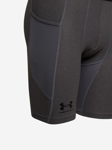 UNDER ARMOUR - Skinny Calças de desporto em cinzento